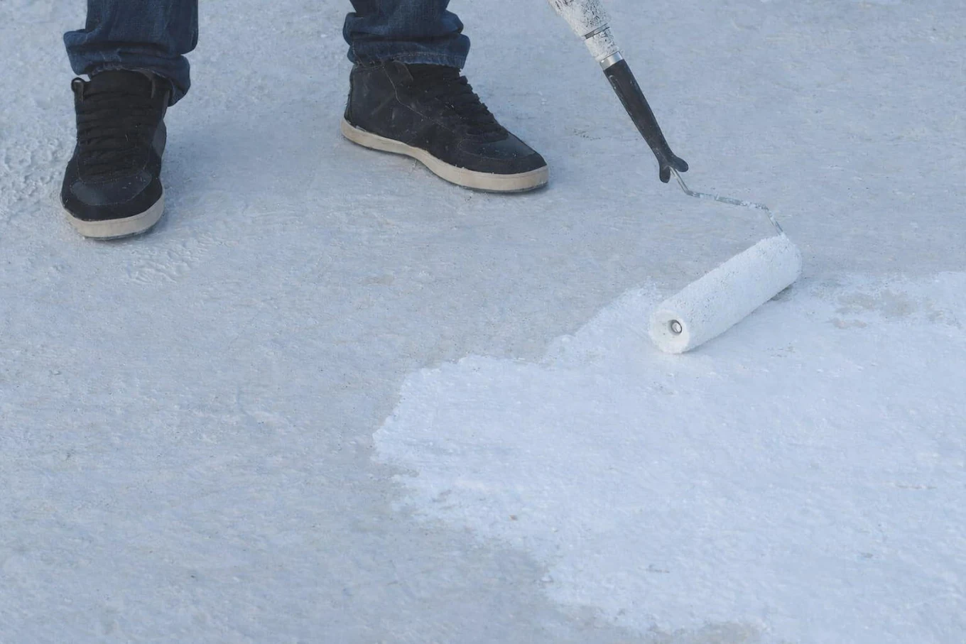 Reflective roof coating application on a flat roof