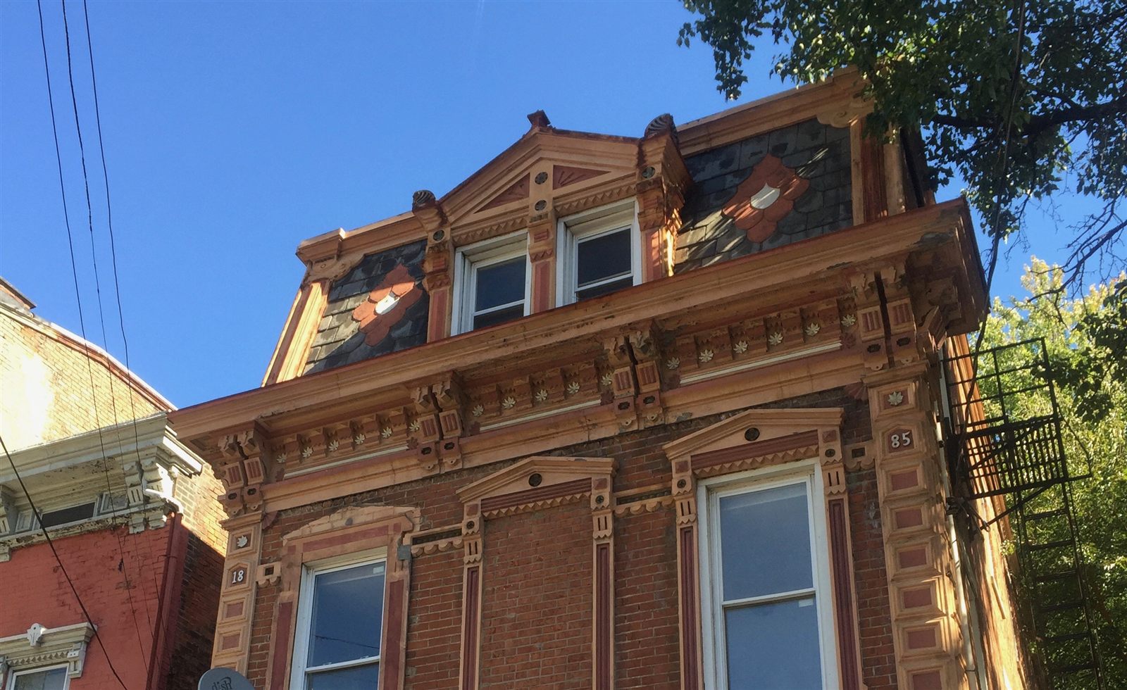 Victorian slate mansard roof with ornate cornice in Washington DC
